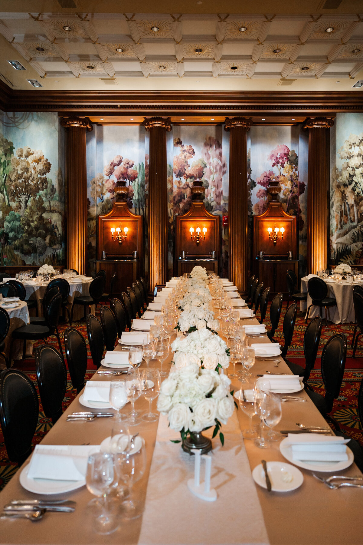 long tables setup in the ballroom at the duquesne club for a wedding reception