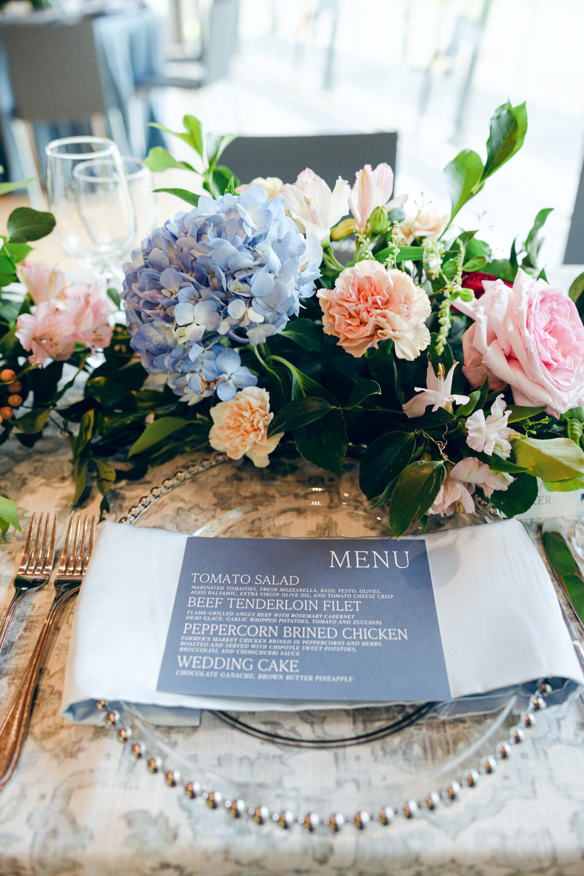 A wedding day photo of the reception dinner menu at Crystal Bridges Museum of American Art in Arkansas