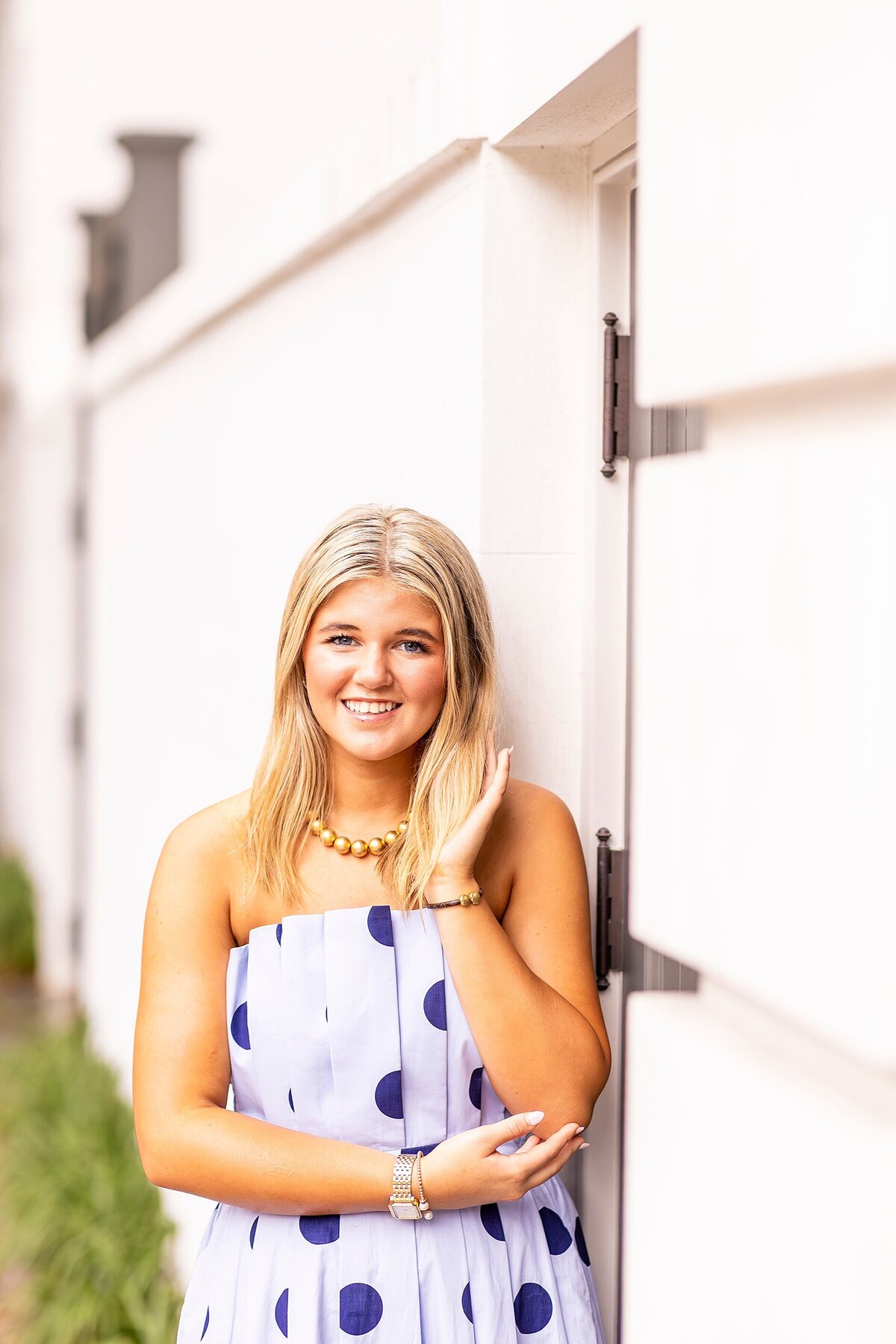 Senior portrait session on Rainbow Row streets capturing natural movement, confidence, and joy