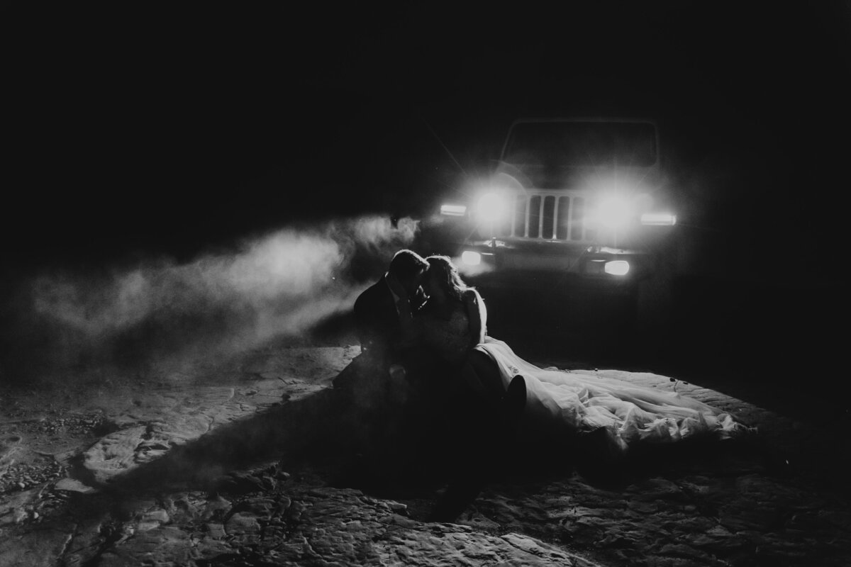 couple sitting on the ground during elopement