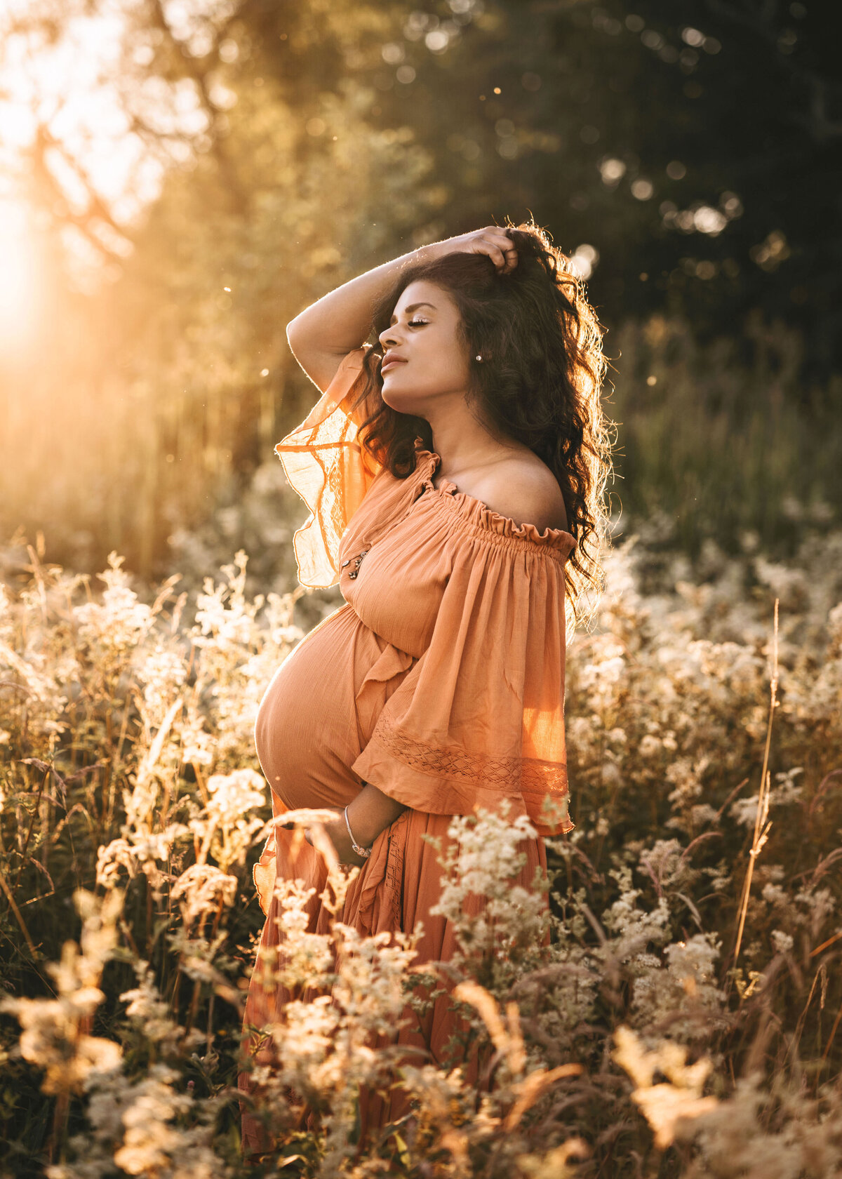 Photo of a pregnant woman in dress at sunset maternity photoshoot in Shrewsbury