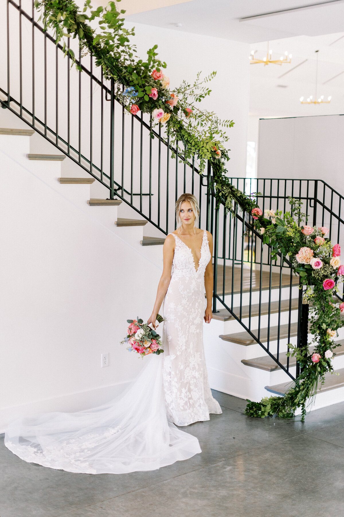 bride in her wedding dress and her flowers at the hutton house