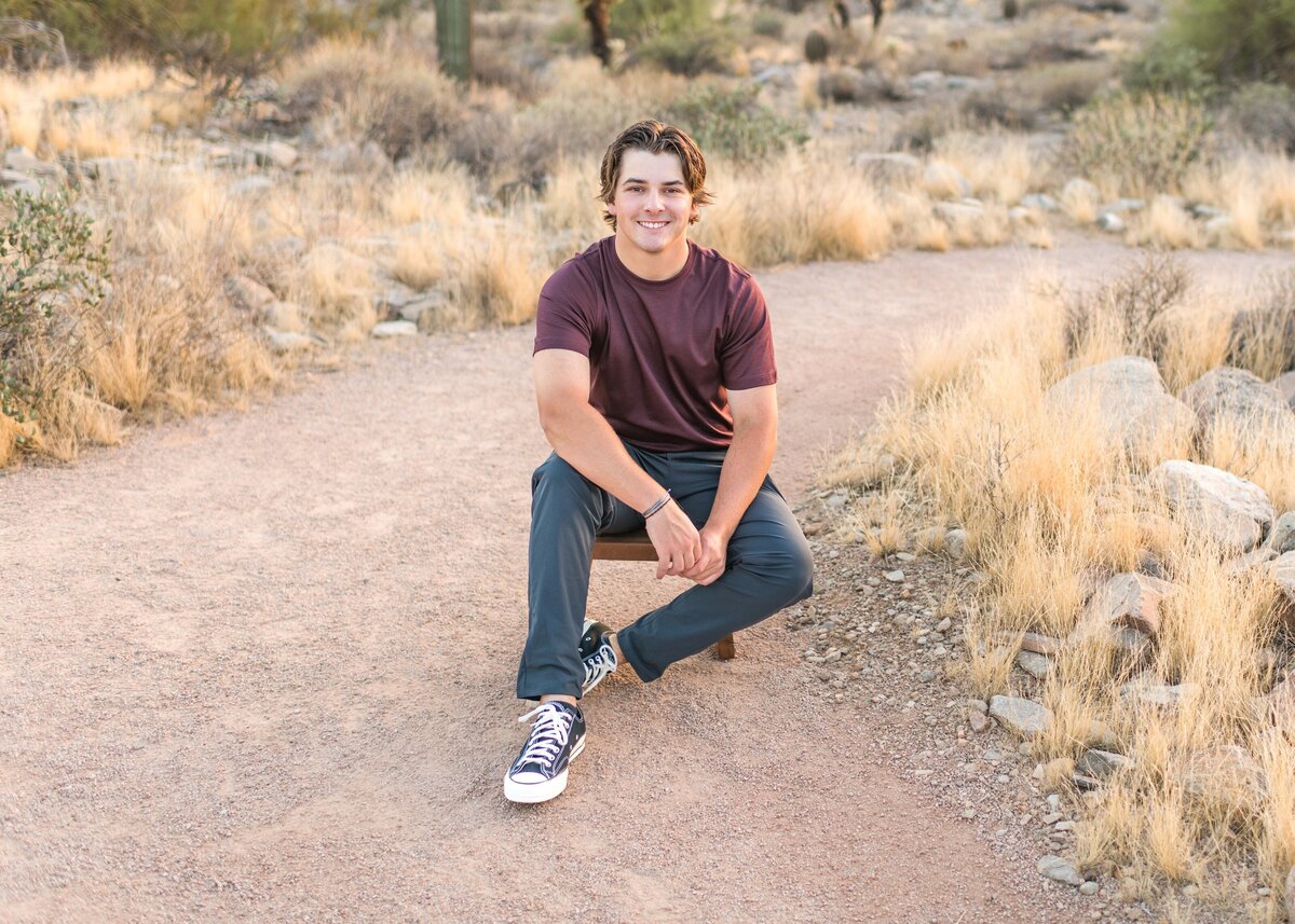 desert mountain high school senior posing for senior photos in the north scottsdale desert