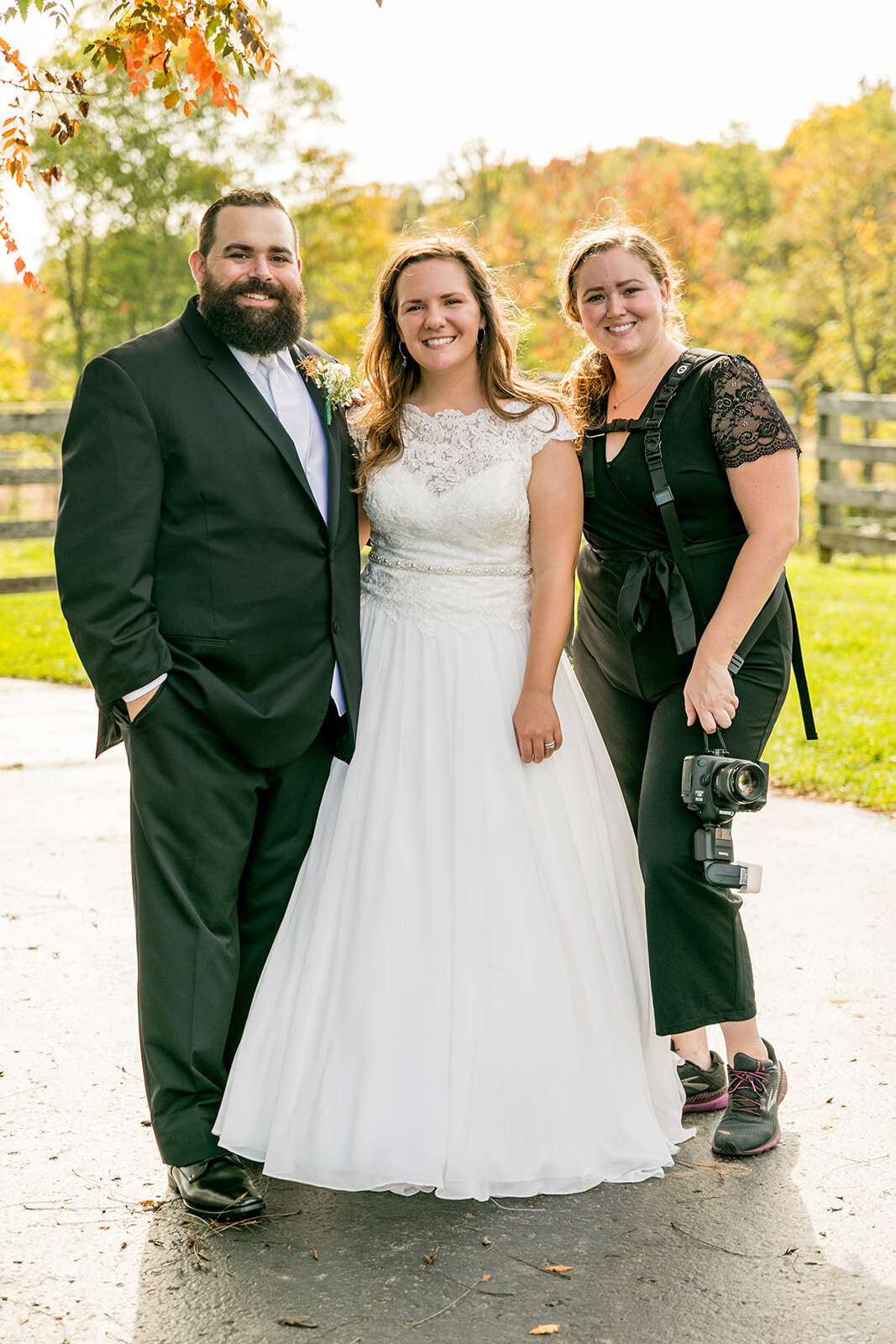 Bride and groom with their wedding photographer