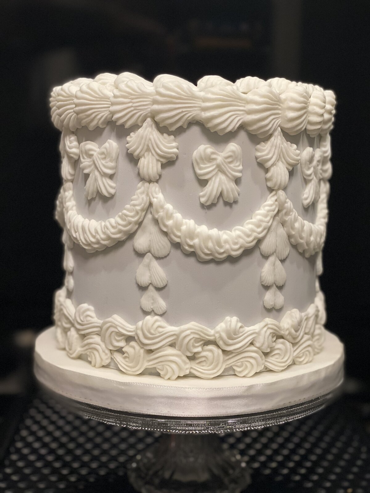 greay and white lambeth birthday cake