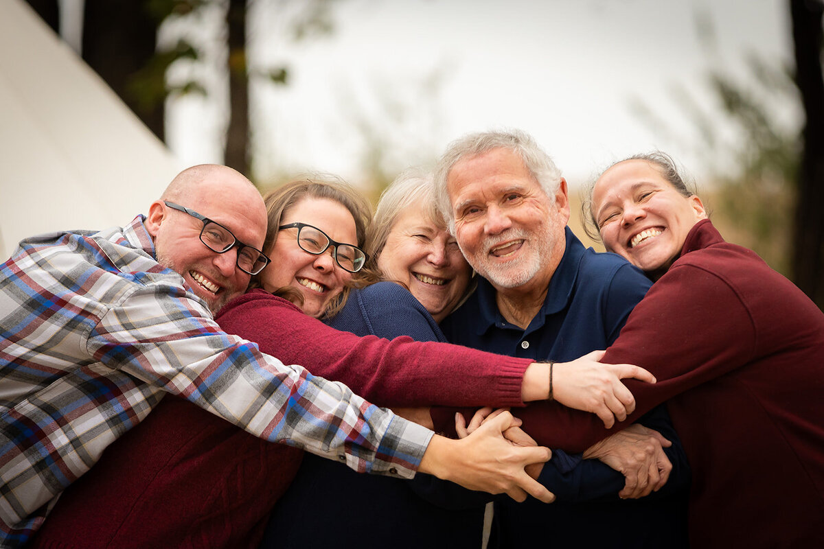 family hugging and laughing