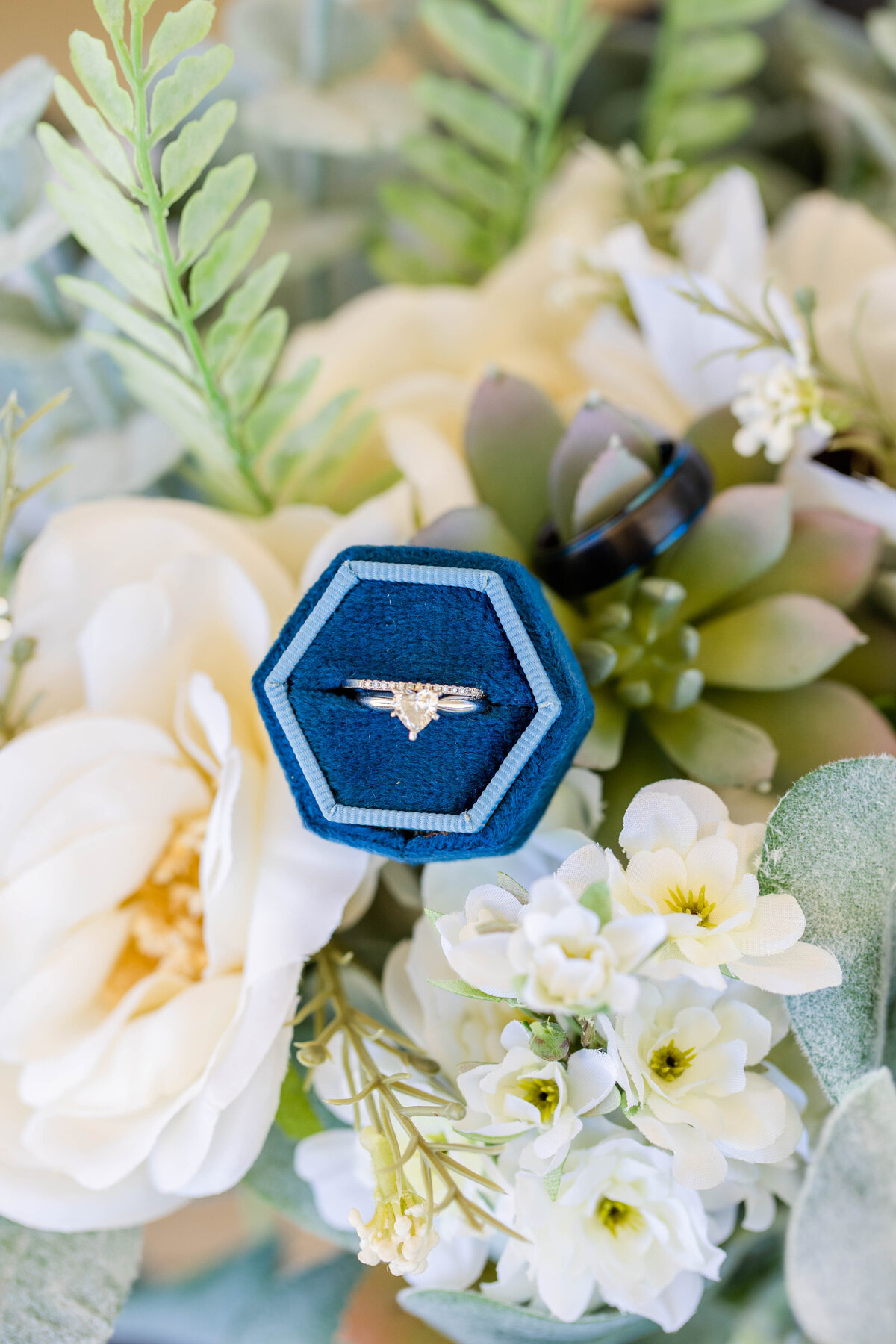 engagement ring in navy ring box with blue and white florals