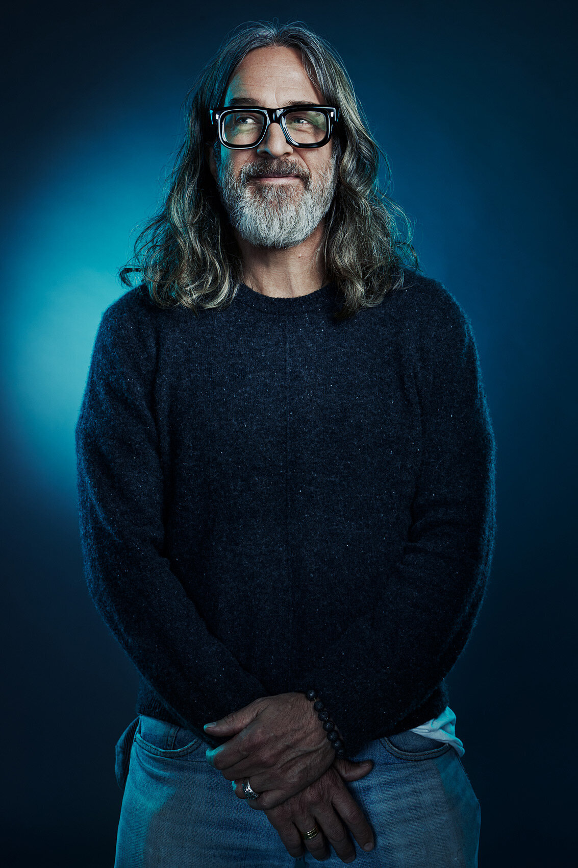 Moody portrait of Peter Stark in a dark sweater with a serious expression, photographed by Ylva Erevall.