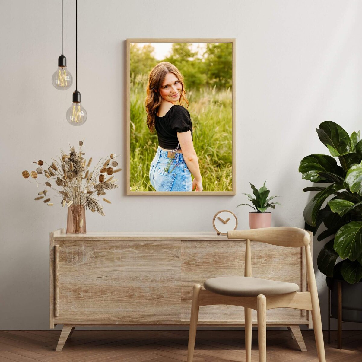 image of an entry way with a photo of a  female teenager hanging above a buffet