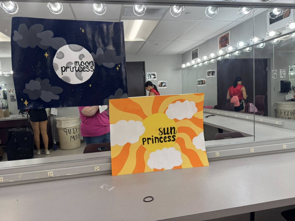 sun and moon princess posters in the dressing room for recital