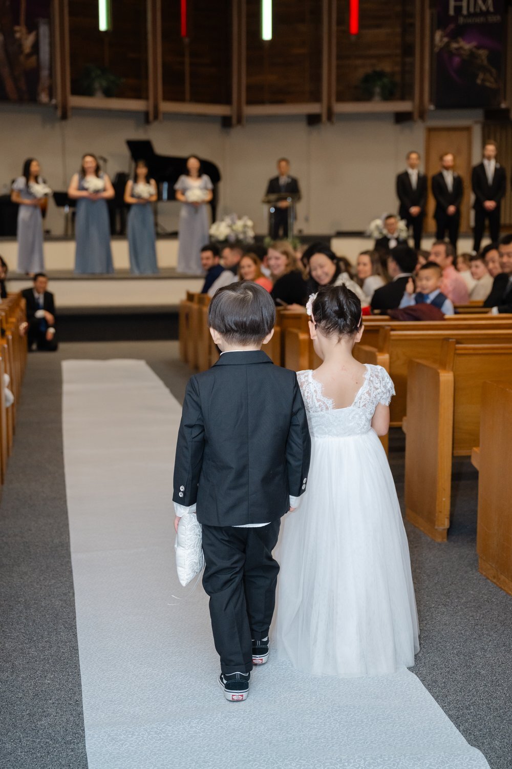 seattle church wedding flower girl and ring bearer walk up aisle