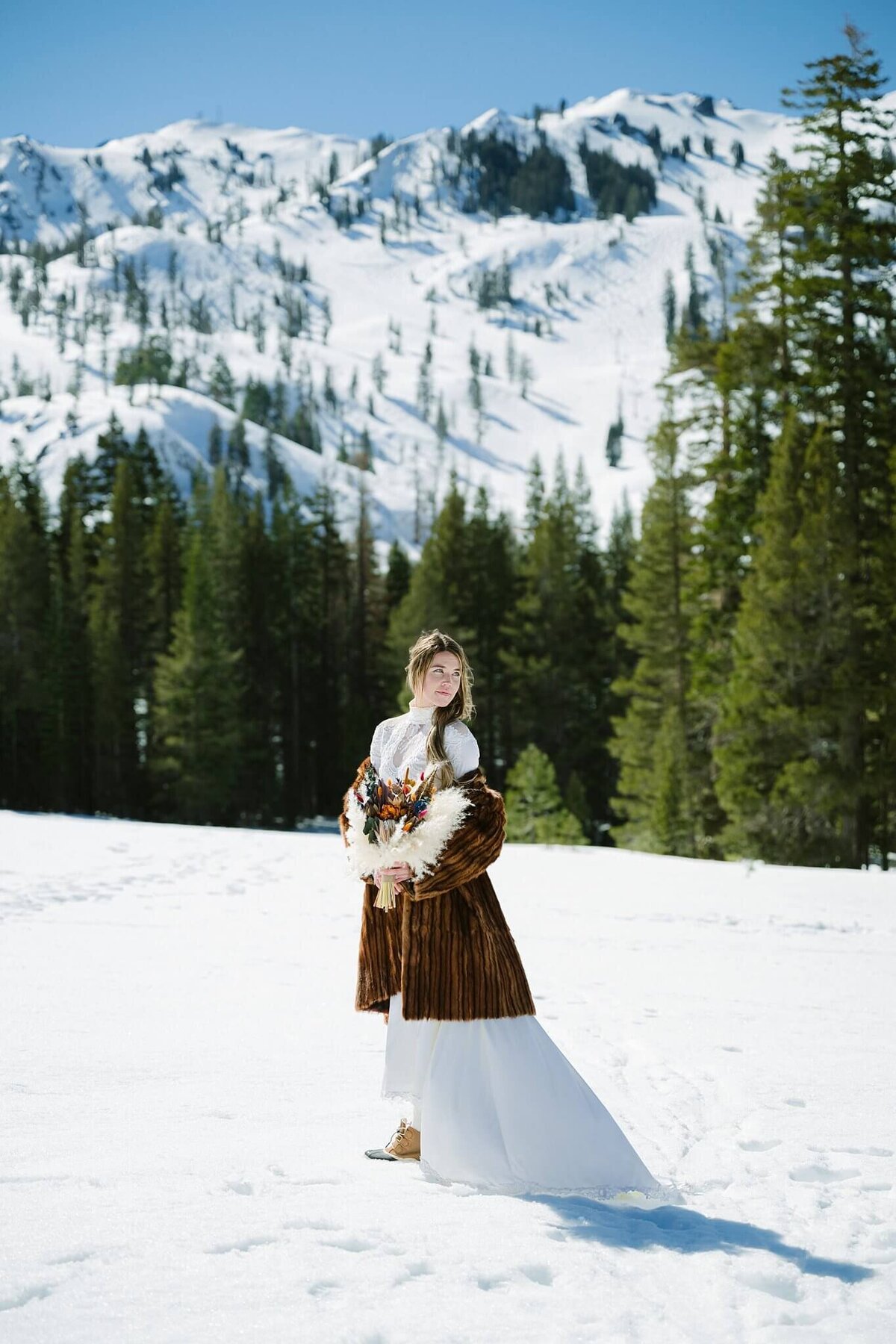 bride portrait in winter in Tahoe with fur capelet from grandmother