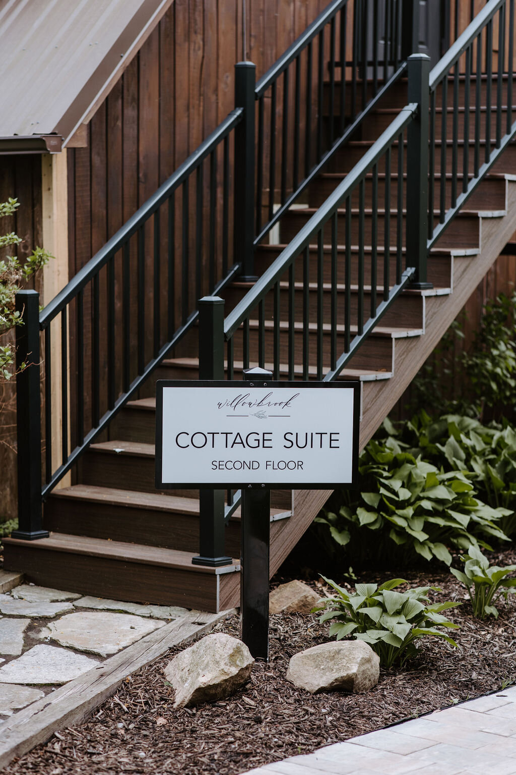 image of the sign for the second story cottage overnight suite at Willowbrook wedding venue