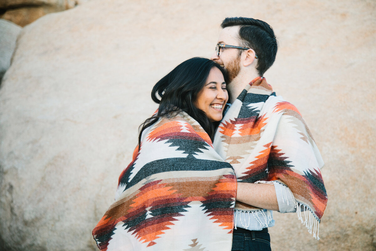 man and woman wrapped in blanket