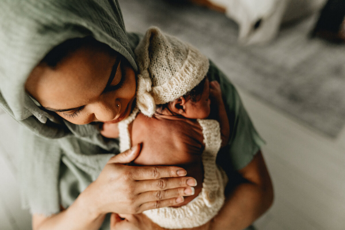 Mom holding new born baby.