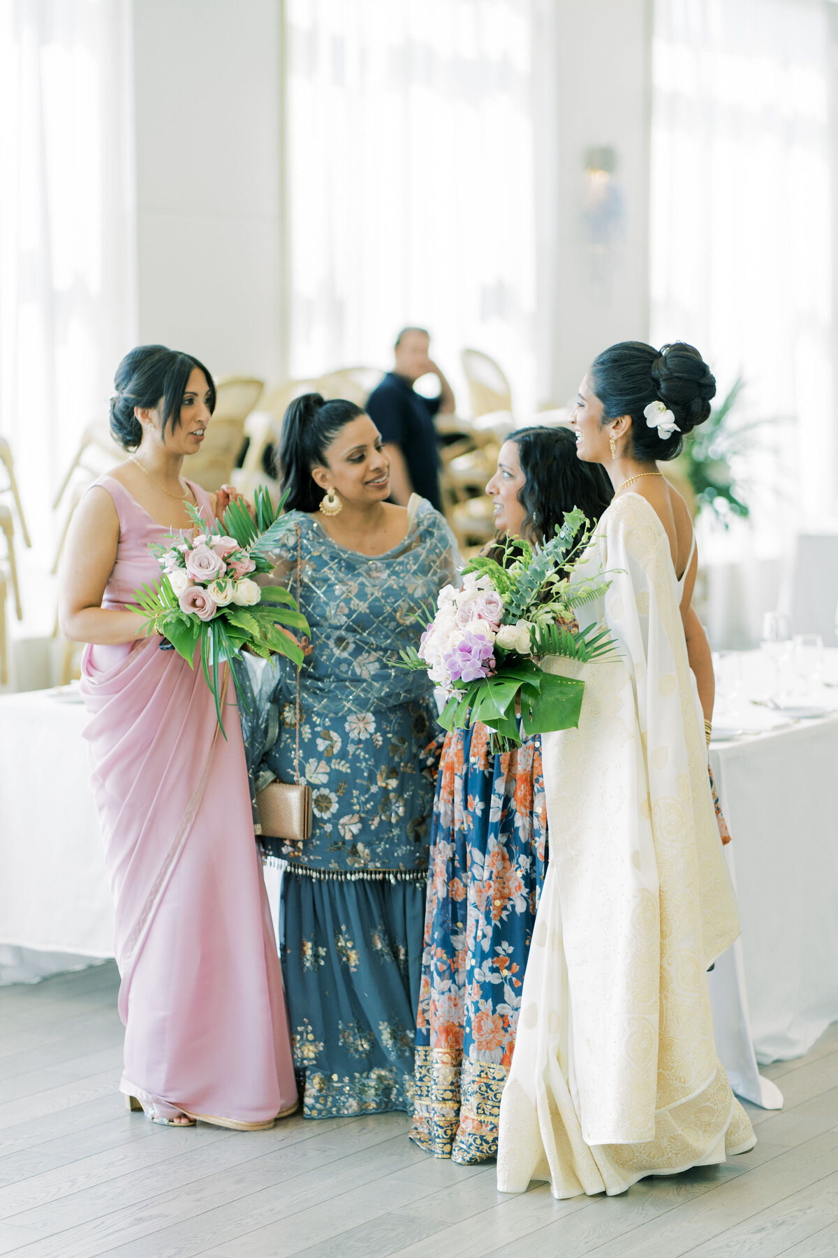 Bride and friends share a moment indian friends at the pearle hotel