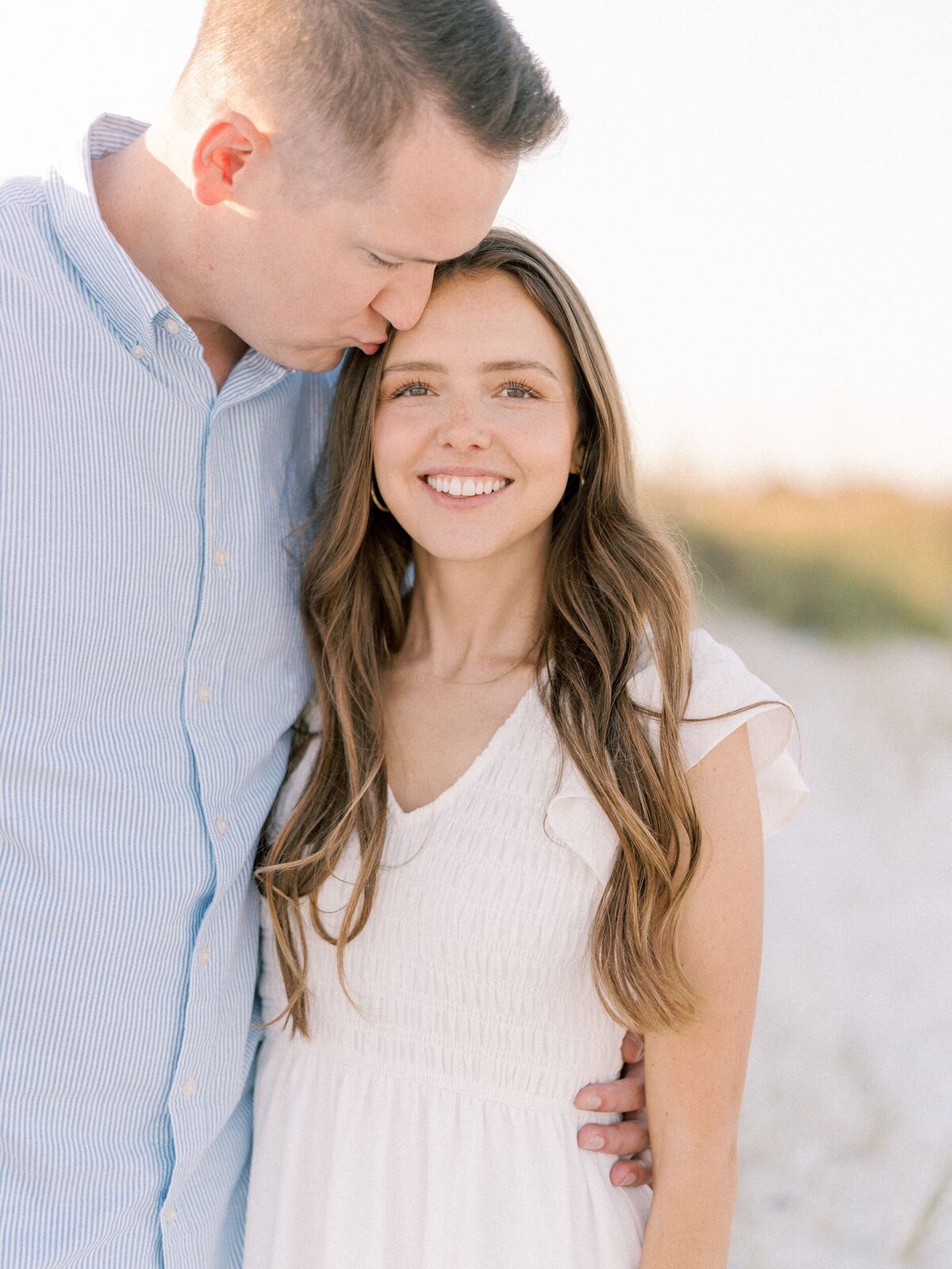 Parents embracing during beach family session