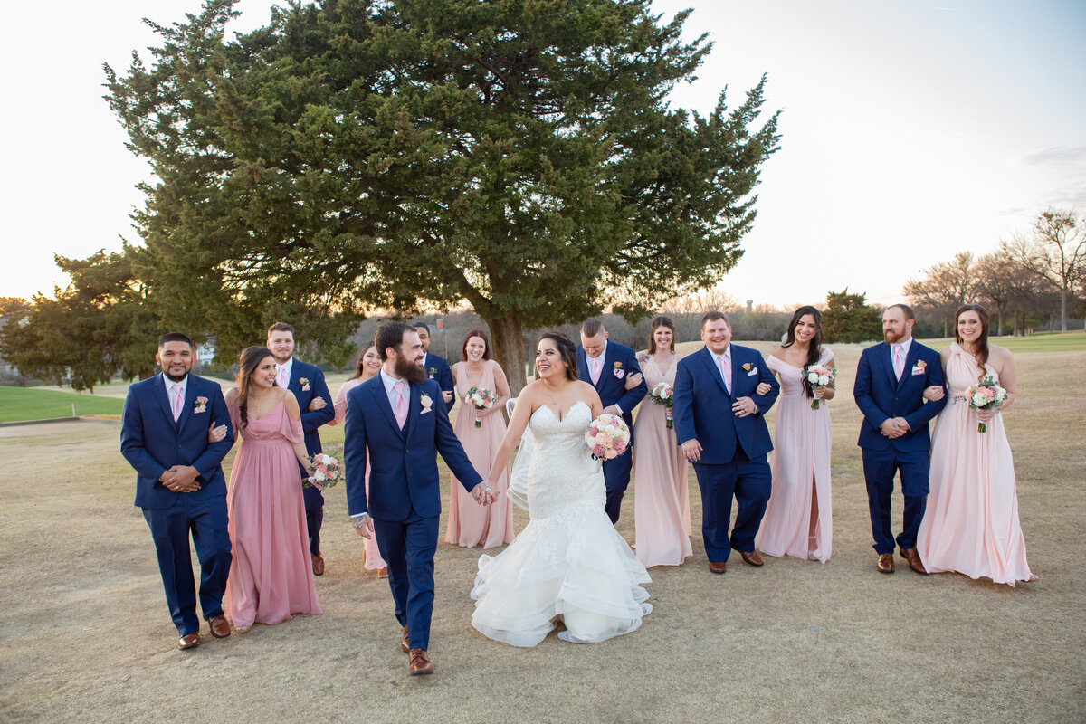 happy wedding party walking