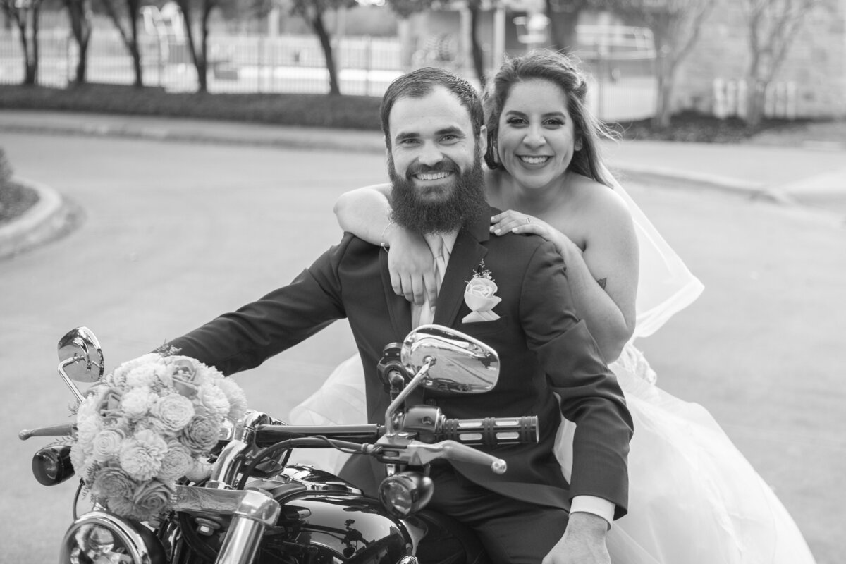 Bride and groom on motorcycle