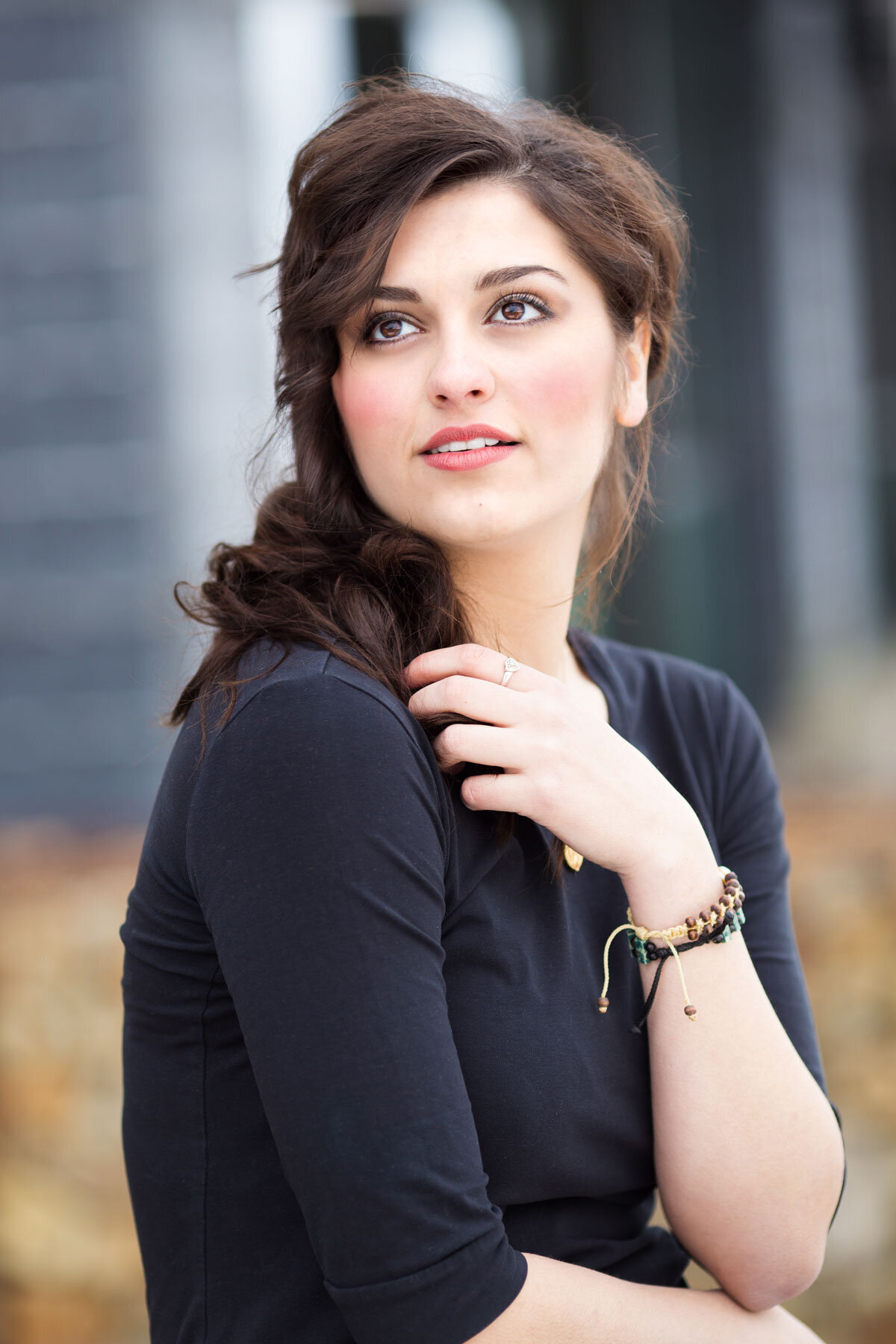 Girl posing for senior pictures looking at the sky in Salt Lake City Utah.