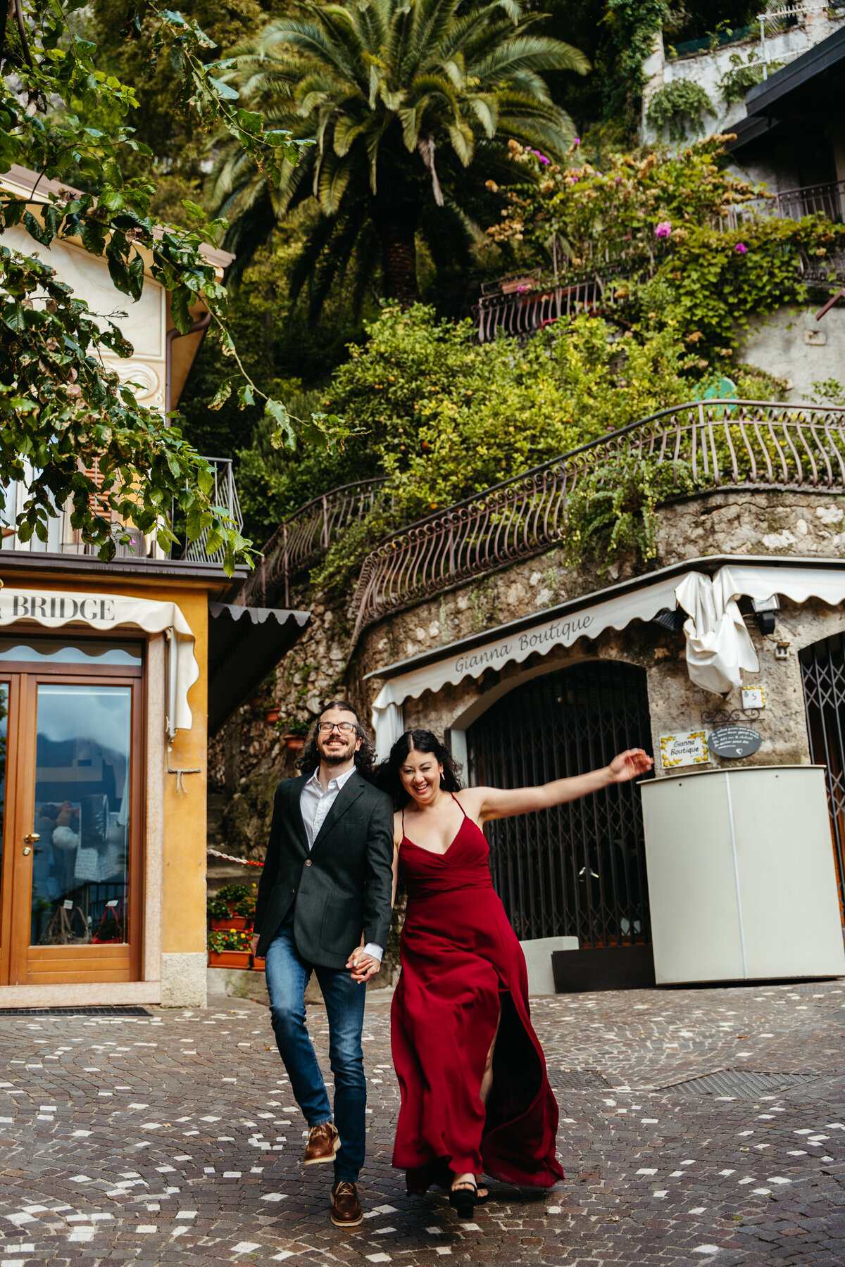 Couple dancing in charming Italian village street