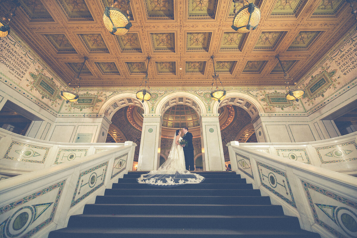 A bride and grooms on the steps of the Chicago Cultural Center