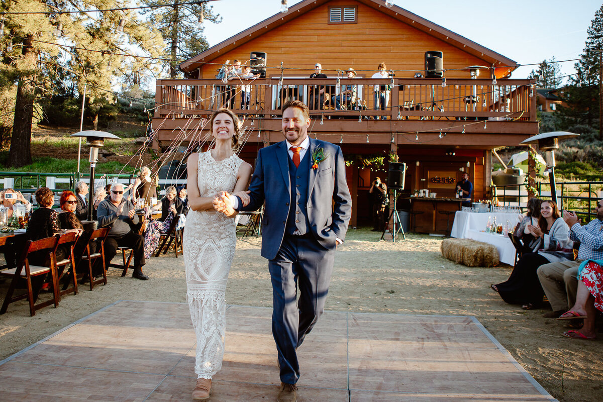 Two marriers walk down the aisle on their wedding day.