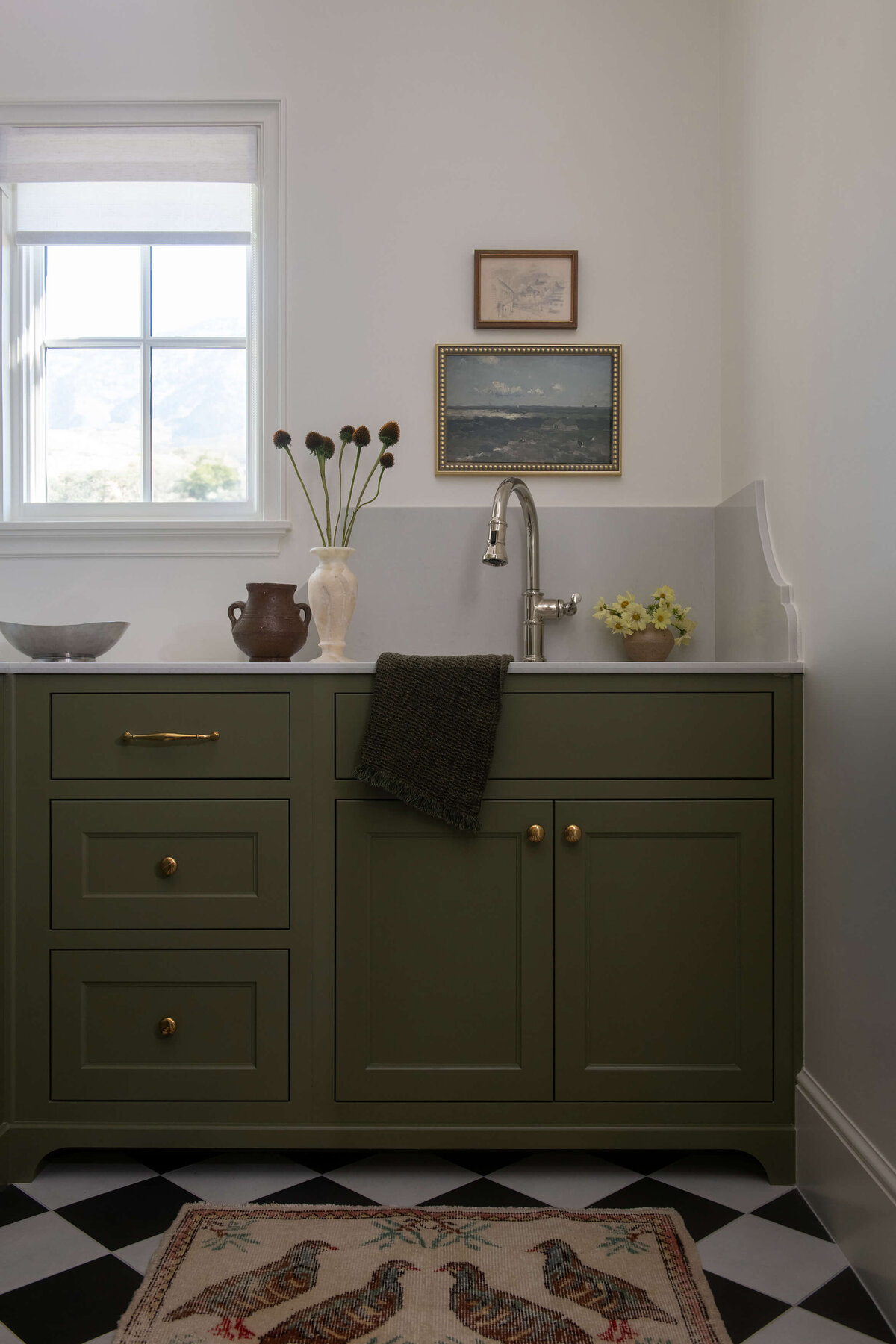 dutch-tudor-laundry-room-green-cabinets-checkered-floor