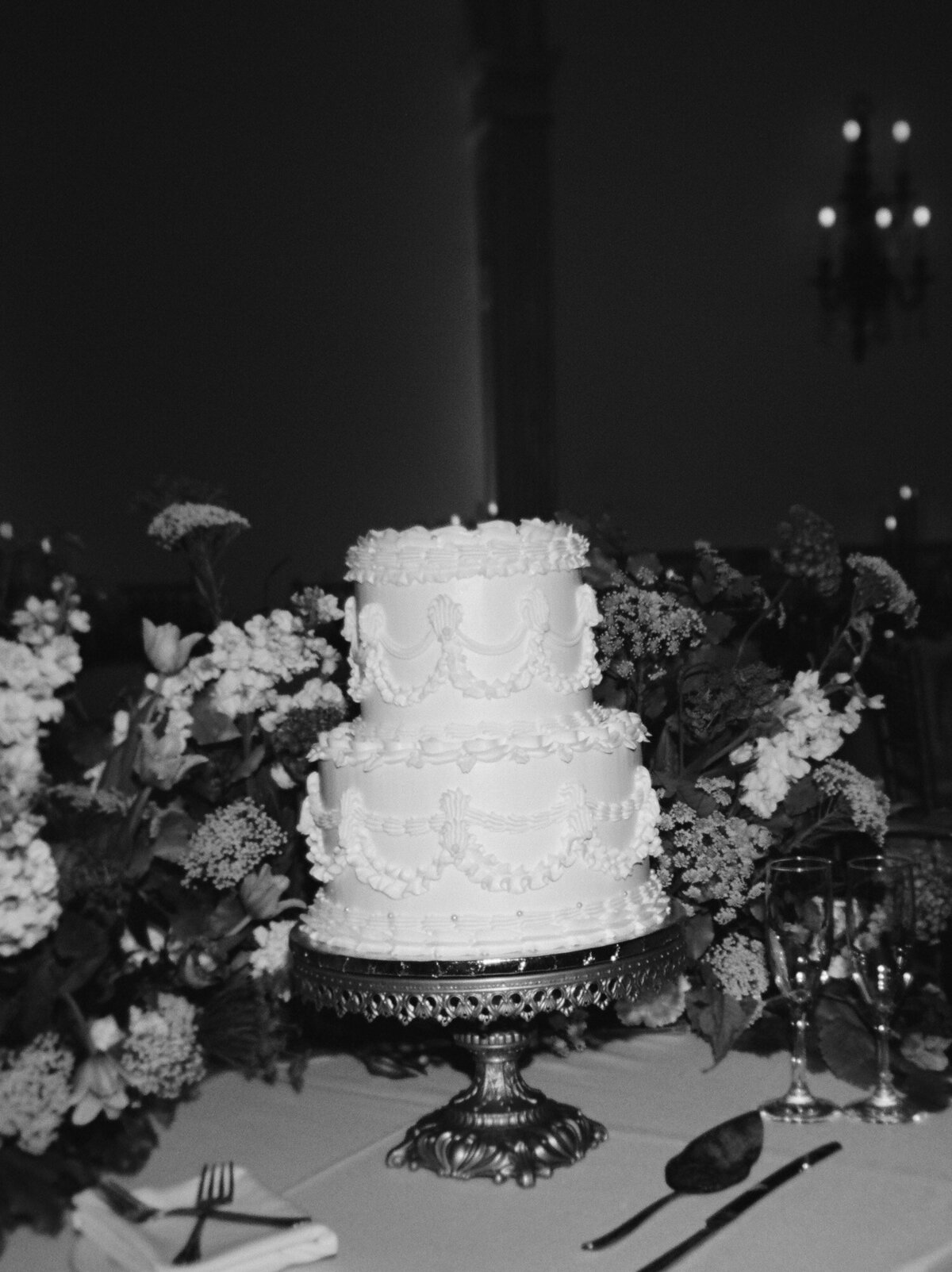 An ornate vintage piped wedding cake at The Colony Club, Detroit