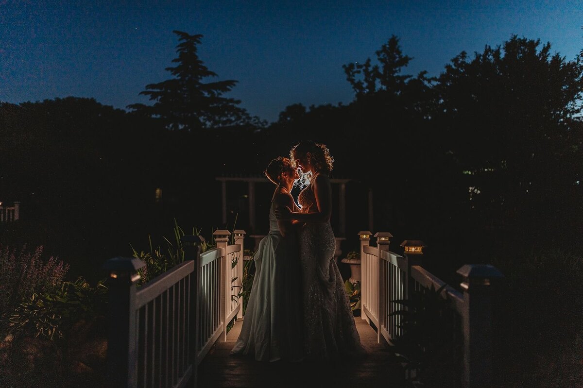 romantic nighttime image of two brides