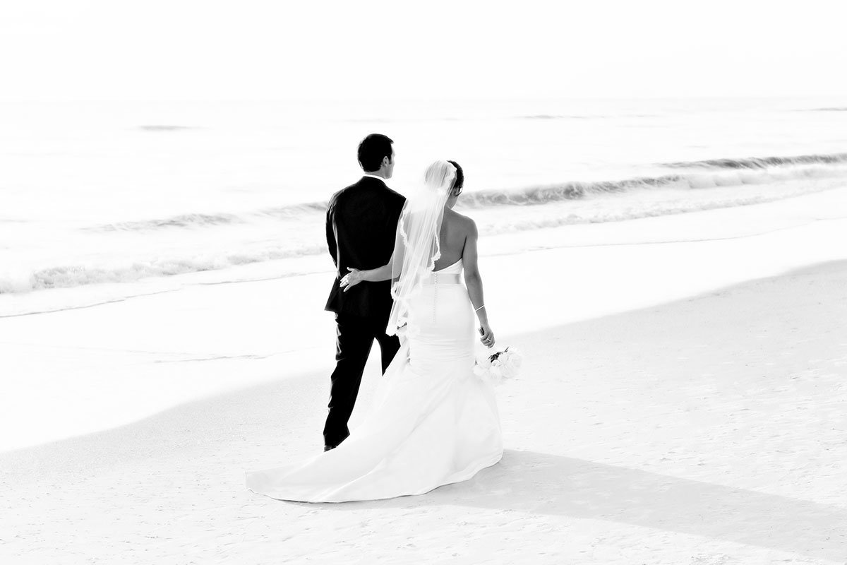 naples beach hotel and golf club wedding bride and groom walking