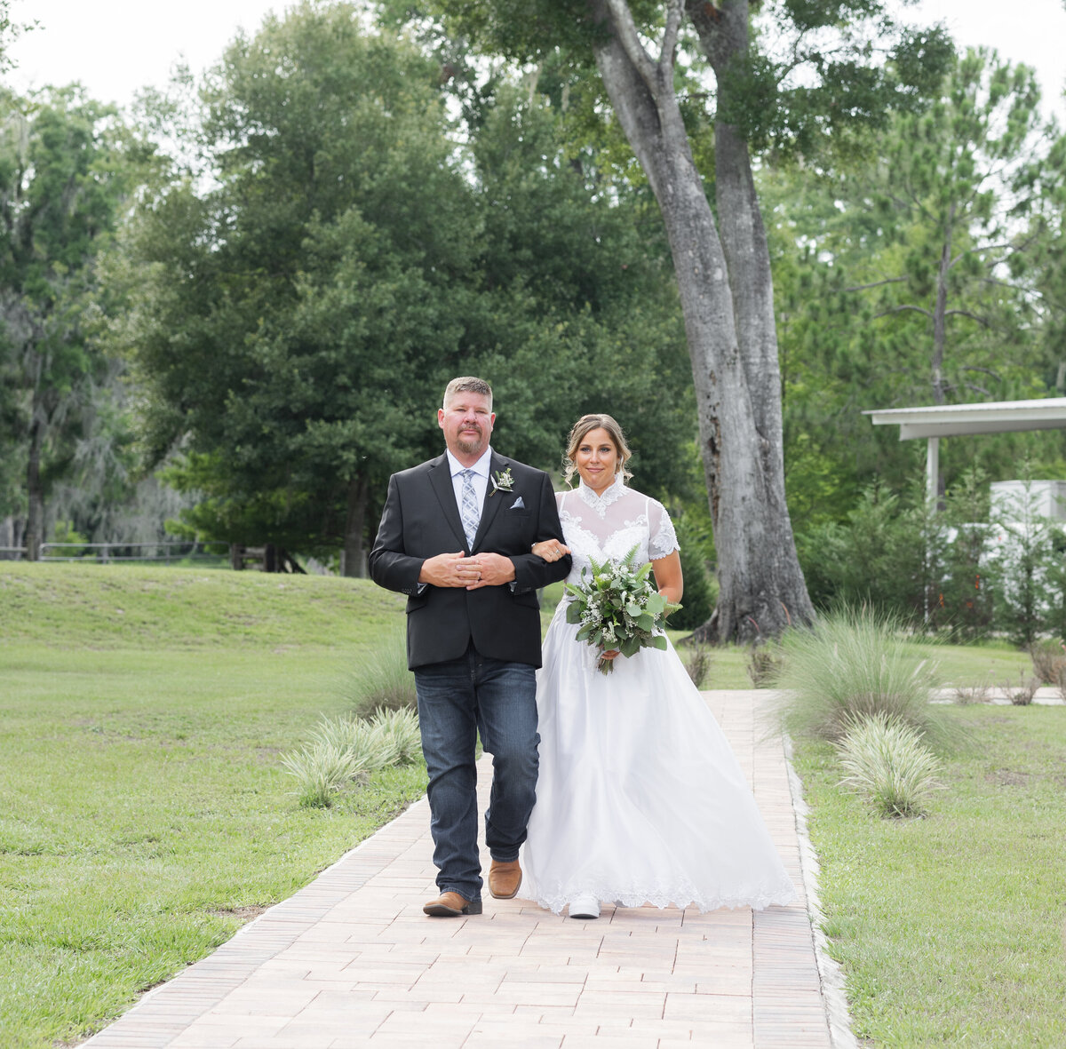 bride-walking-down-the-aisle-Cypress-Creek-Farmhouse-Orlando