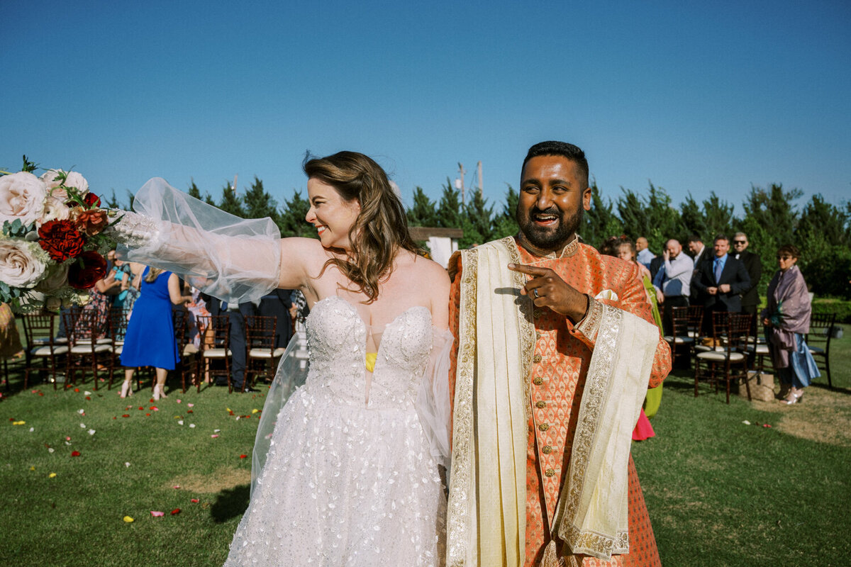 excited-couple-just-married-processional