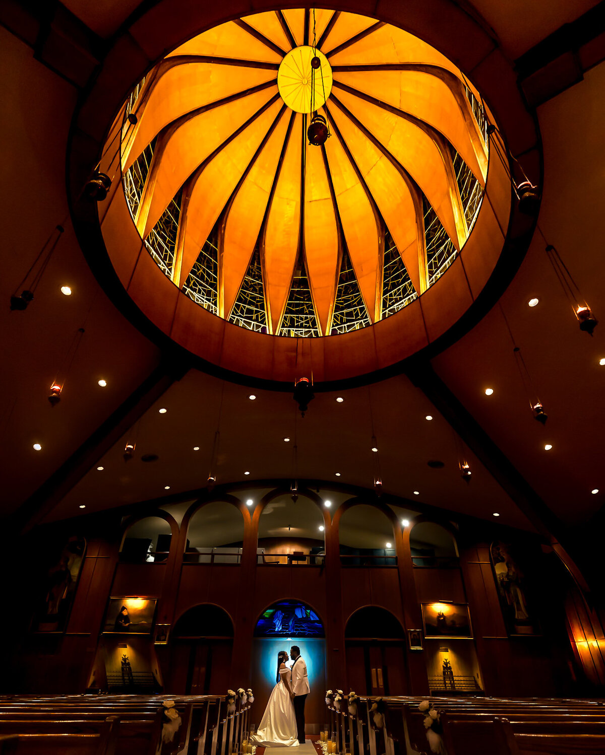 intimate-wedding-moment-in-a-stunning-church-with-a-bride-and-groom-under-a-glowing-dome