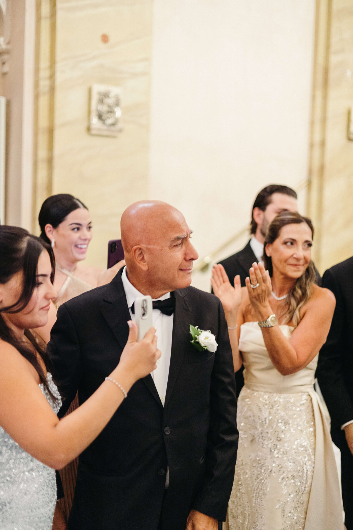 Wedding guests reacting with joy and emotion during church ceremony

