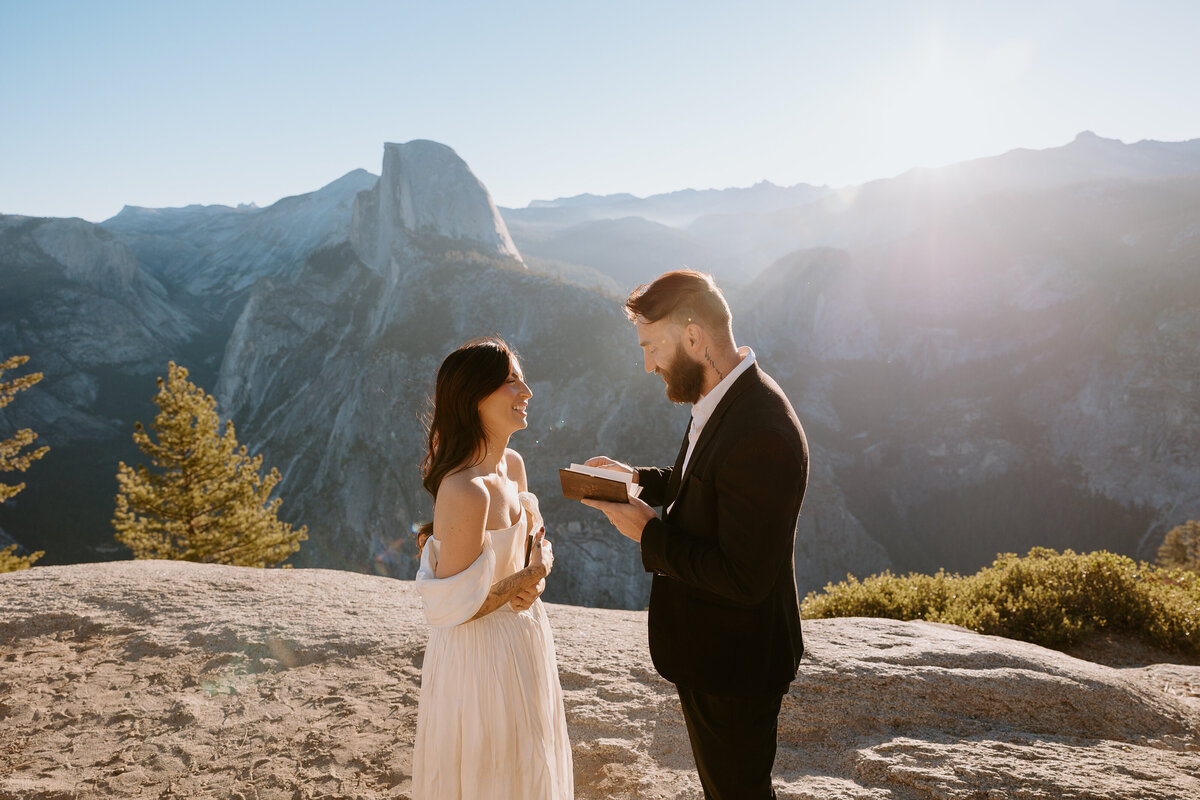 Couple exchanging vows at their Glacier Point elopement