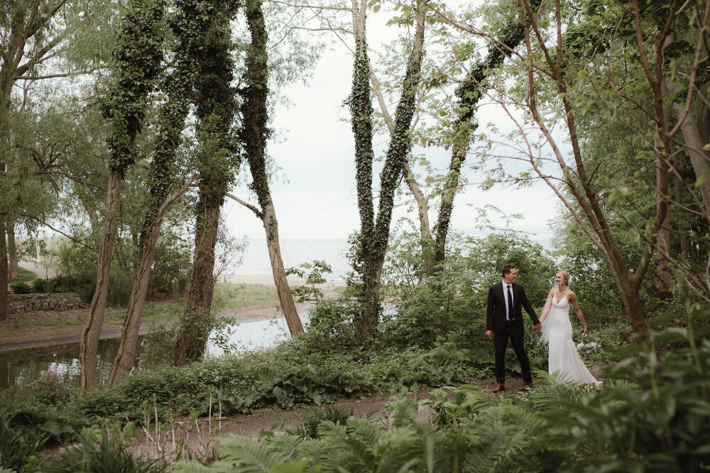 bride-and-groom-walking-through-forest