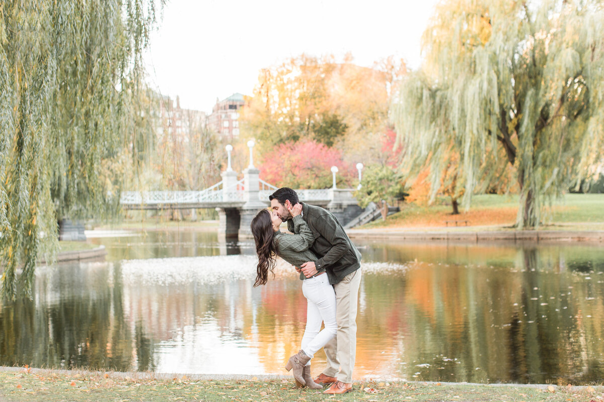 couple kissing in Boston Public Garden in the Fall