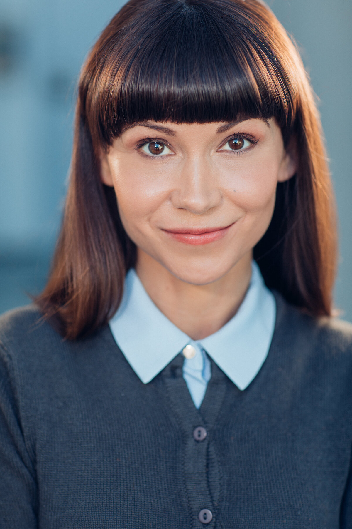 Headshot Photograph Of Young Woman In Blue Buttoned Shirt Los Angeles