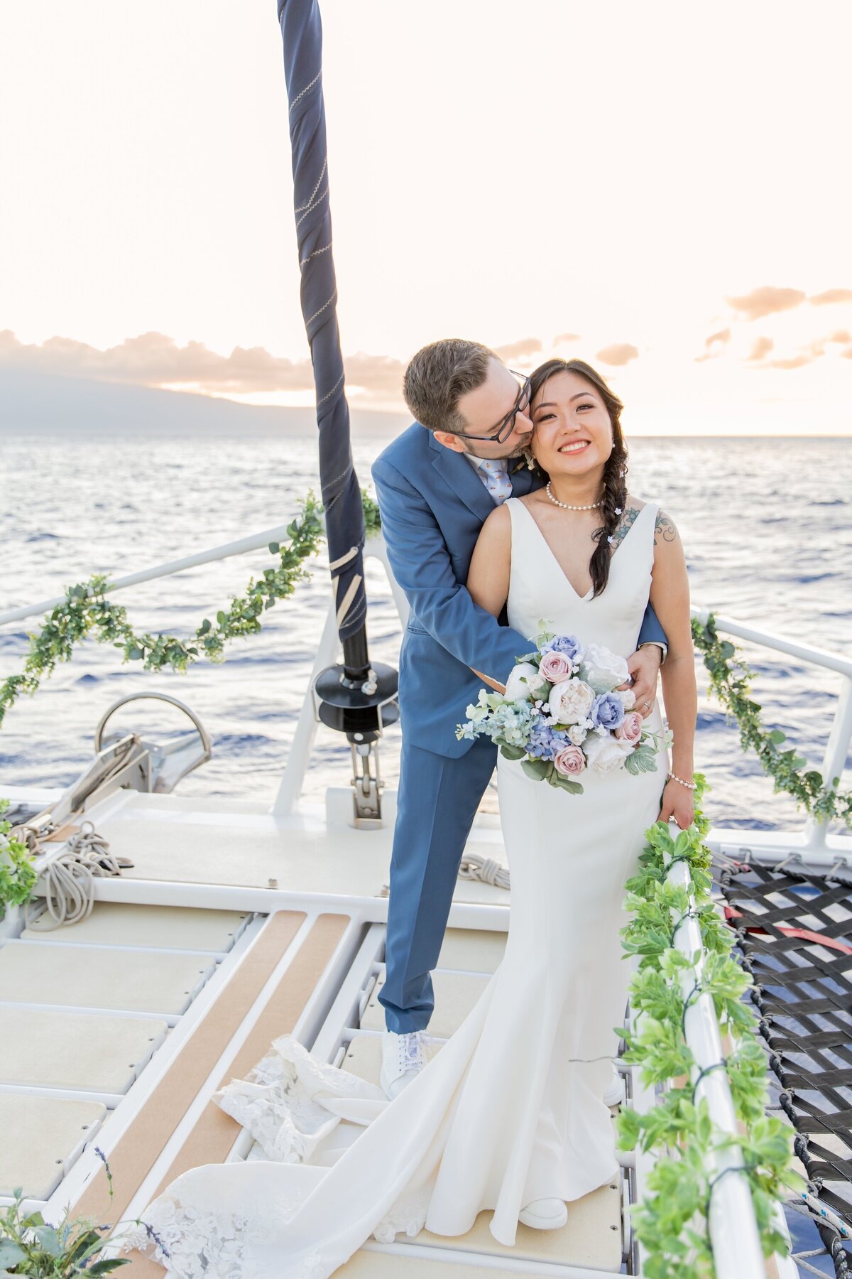 bride and groom photo at sunset on a boat