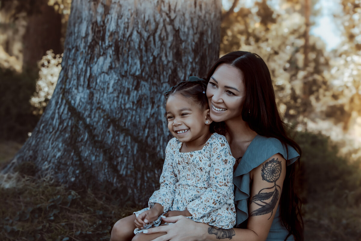 Mother and Daughter Laughing Together by Tree – Prospect Park Redlands