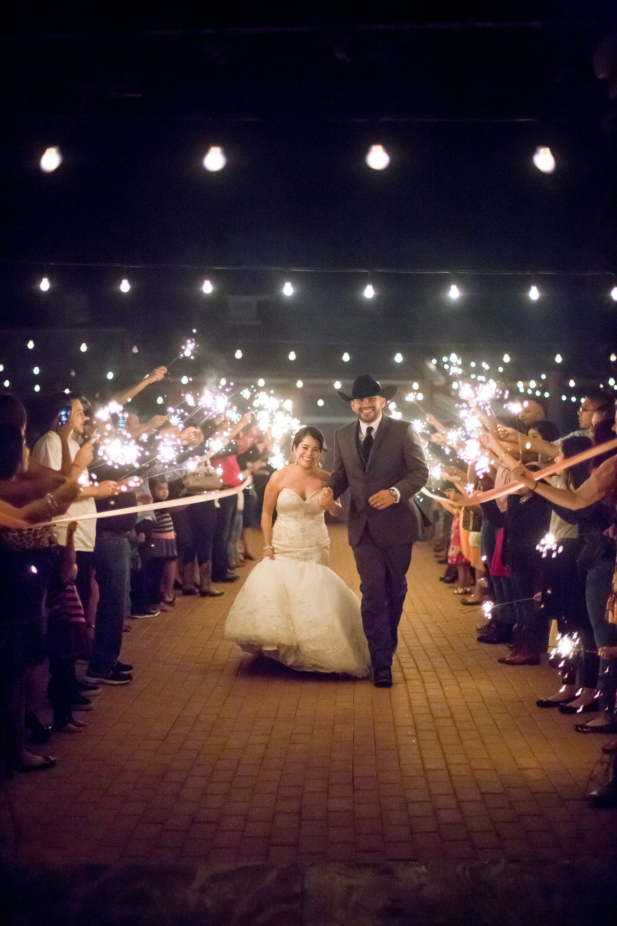 wedding sparkler exit with bride and groom at hoffman ranch wedding venue in castroville texas