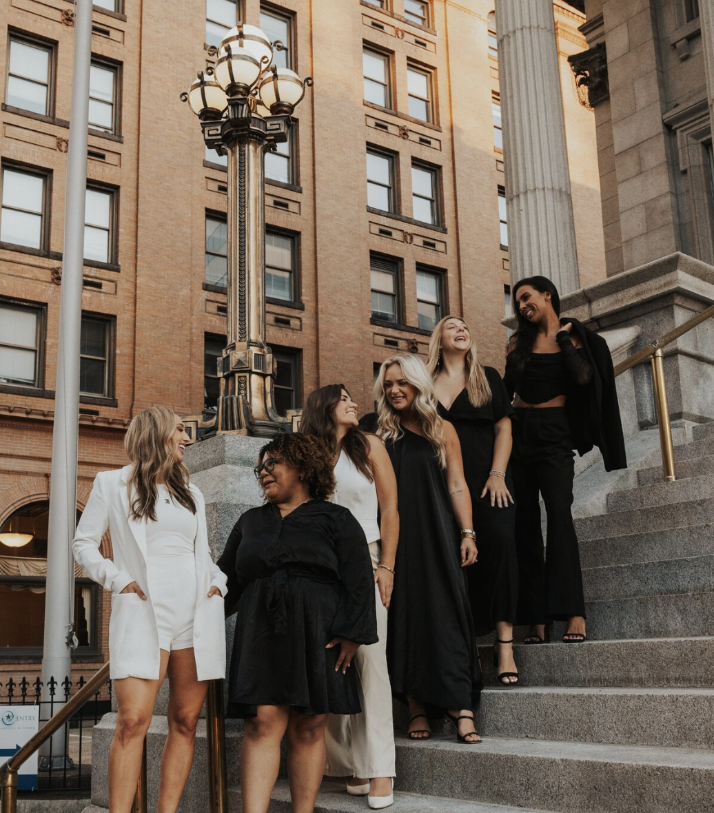 This image captures a moment of camaraderie among members of The Bold Babe Society, a female-focused organization, as portrayed on their website design aimed at building a strong community.