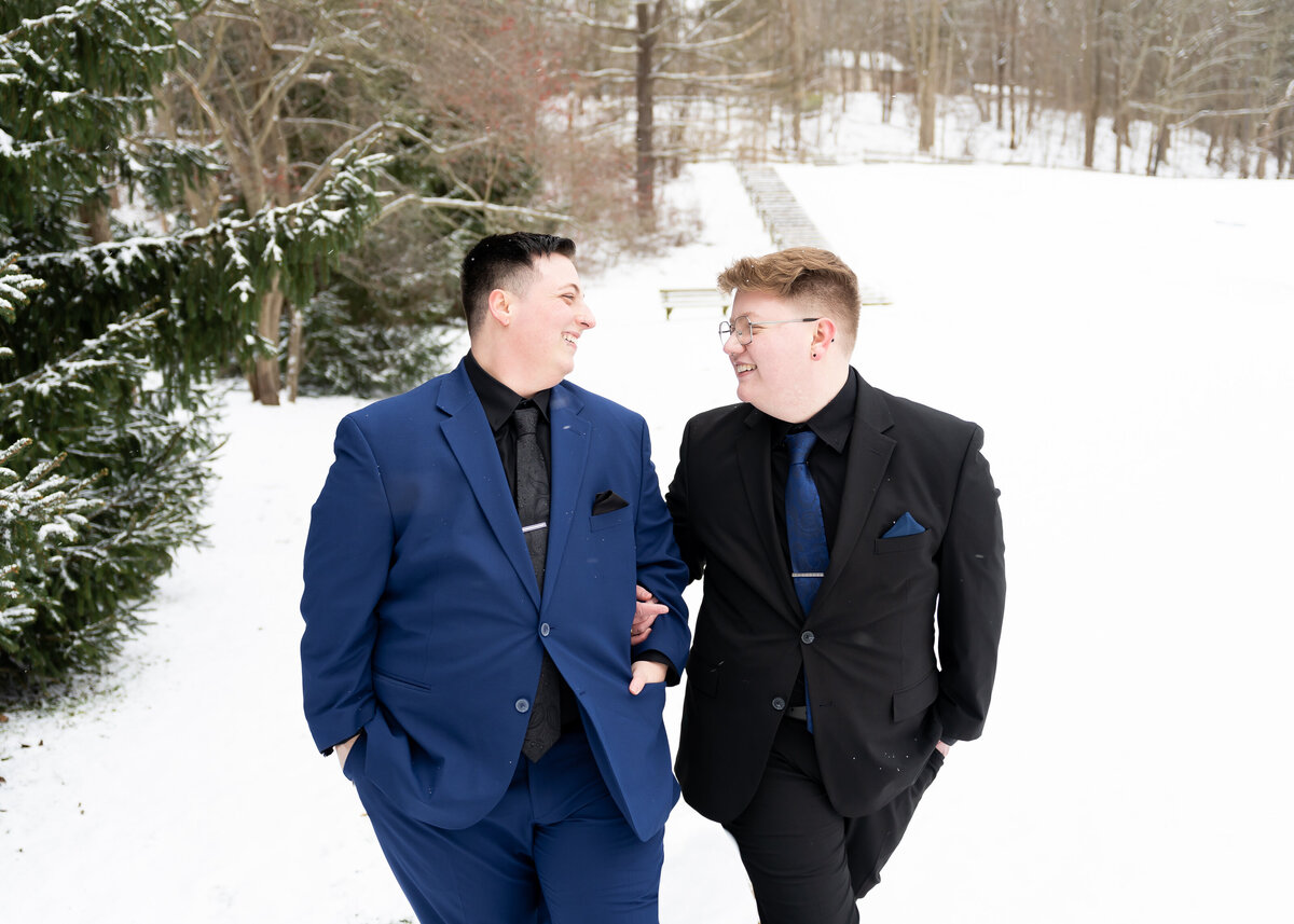 two grooms walking arm in arm winter wedding Cleveland, Ohio