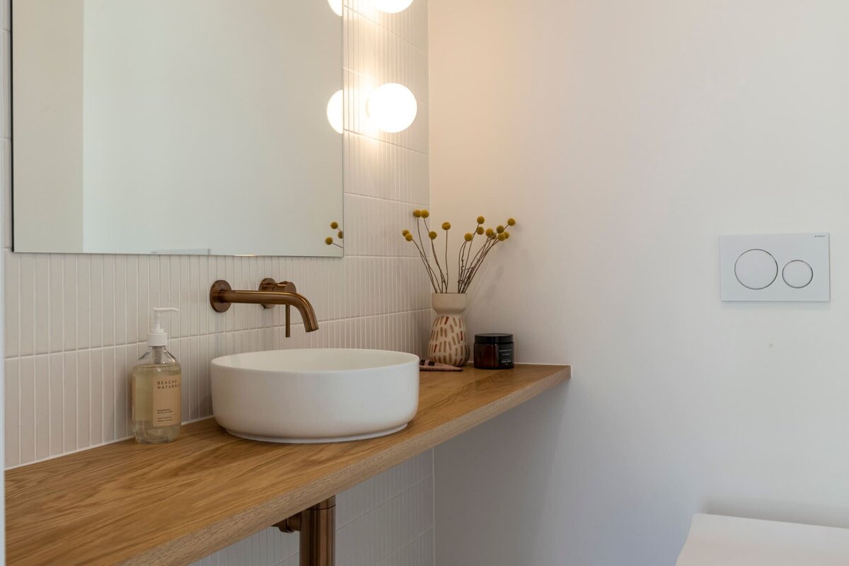 Modern bathroom with wooden features and a white basin