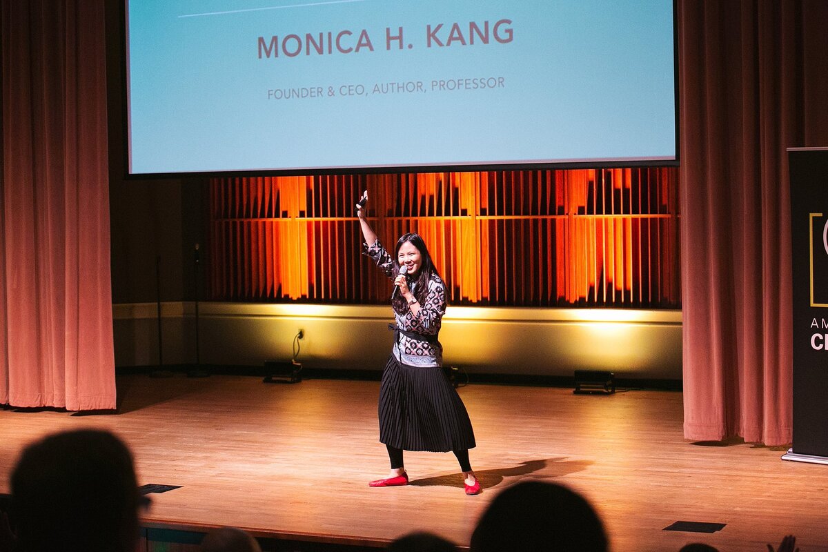 a-dynamic-keynote-speaker-on-stage-at-a-business-conference-in-indianapolis-engaging-the-audience-with-enthusiasm