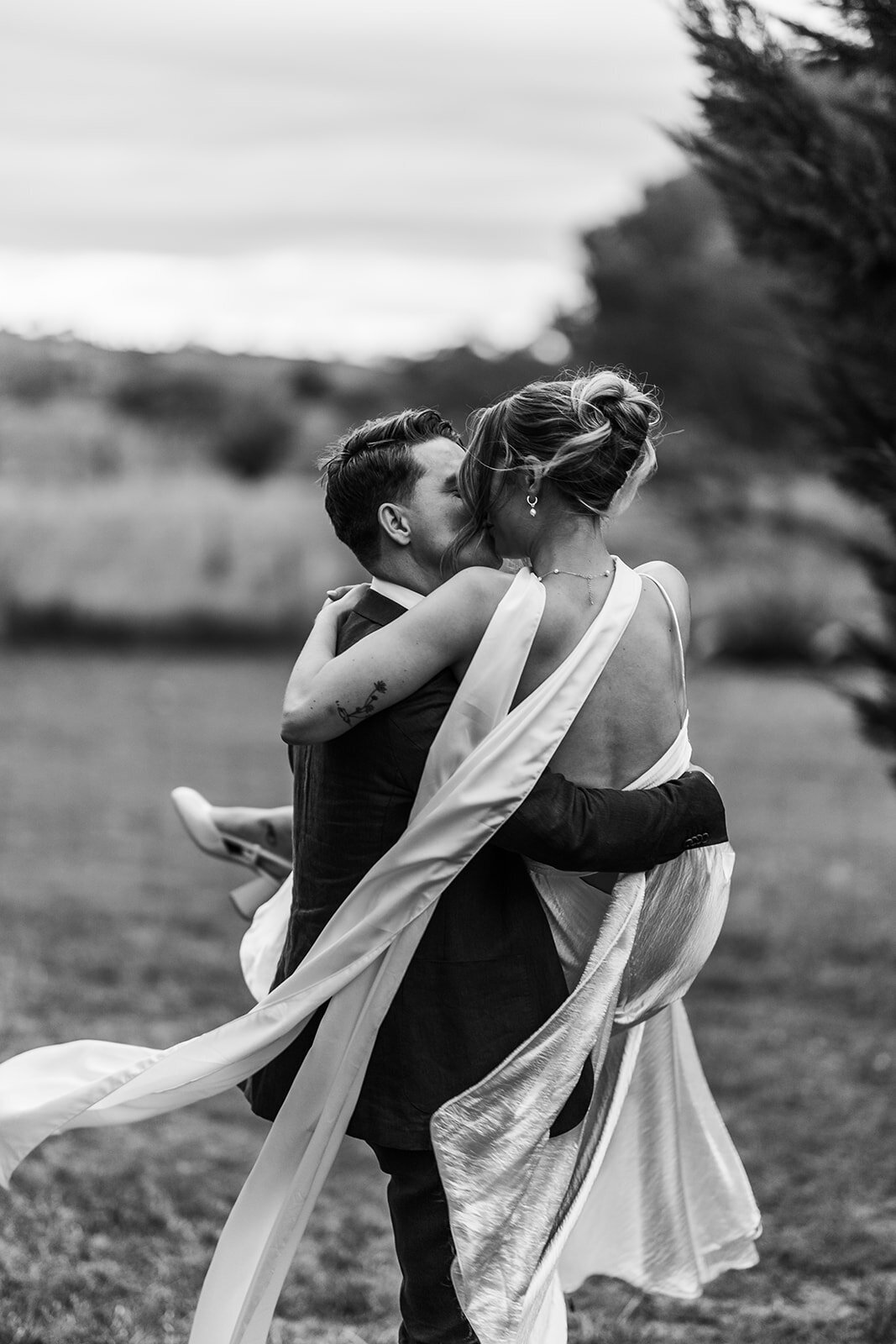 Bride and groom having an imitmiate moment during their sunset photos at the Poachers Pantry marquee gardens 