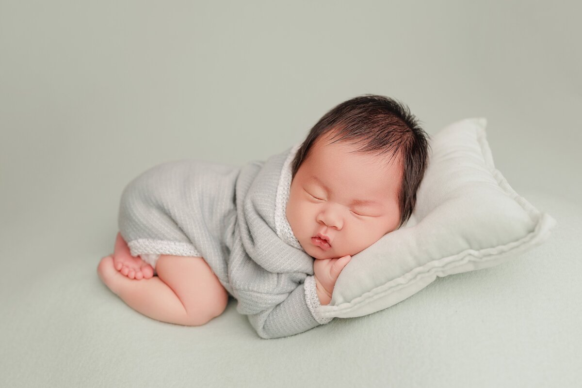 Beautiful newborn portraits in Elk Grove and Sacramento, capturing your baby's precious moments with simple elegance. Book your session today