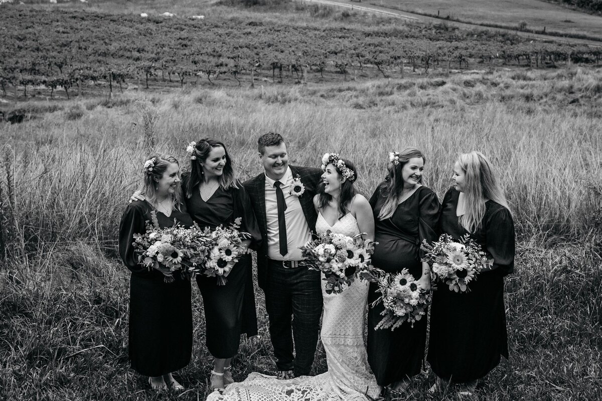 Kara & Ben together with their bridesmaids and groomsmen having a fun photoshoot!