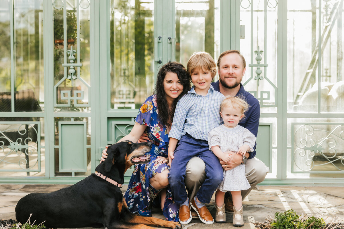 family-poses-with-dog